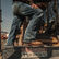 Man on machine wearing Workin' Rebel™ Durango work boots 