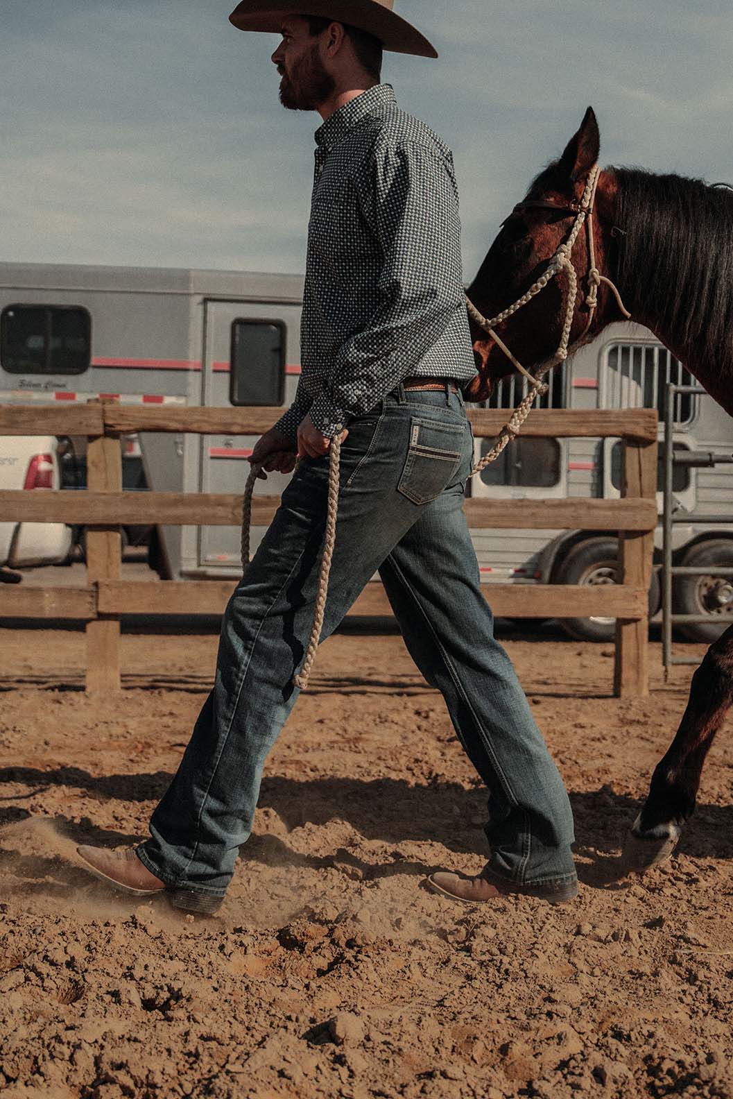 Man Walking Horse